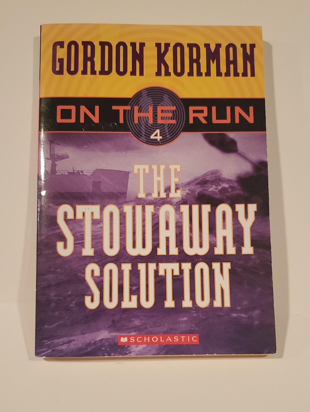Gordon Korman "The Stowaway Solution" (On The Run #4) - Paperback